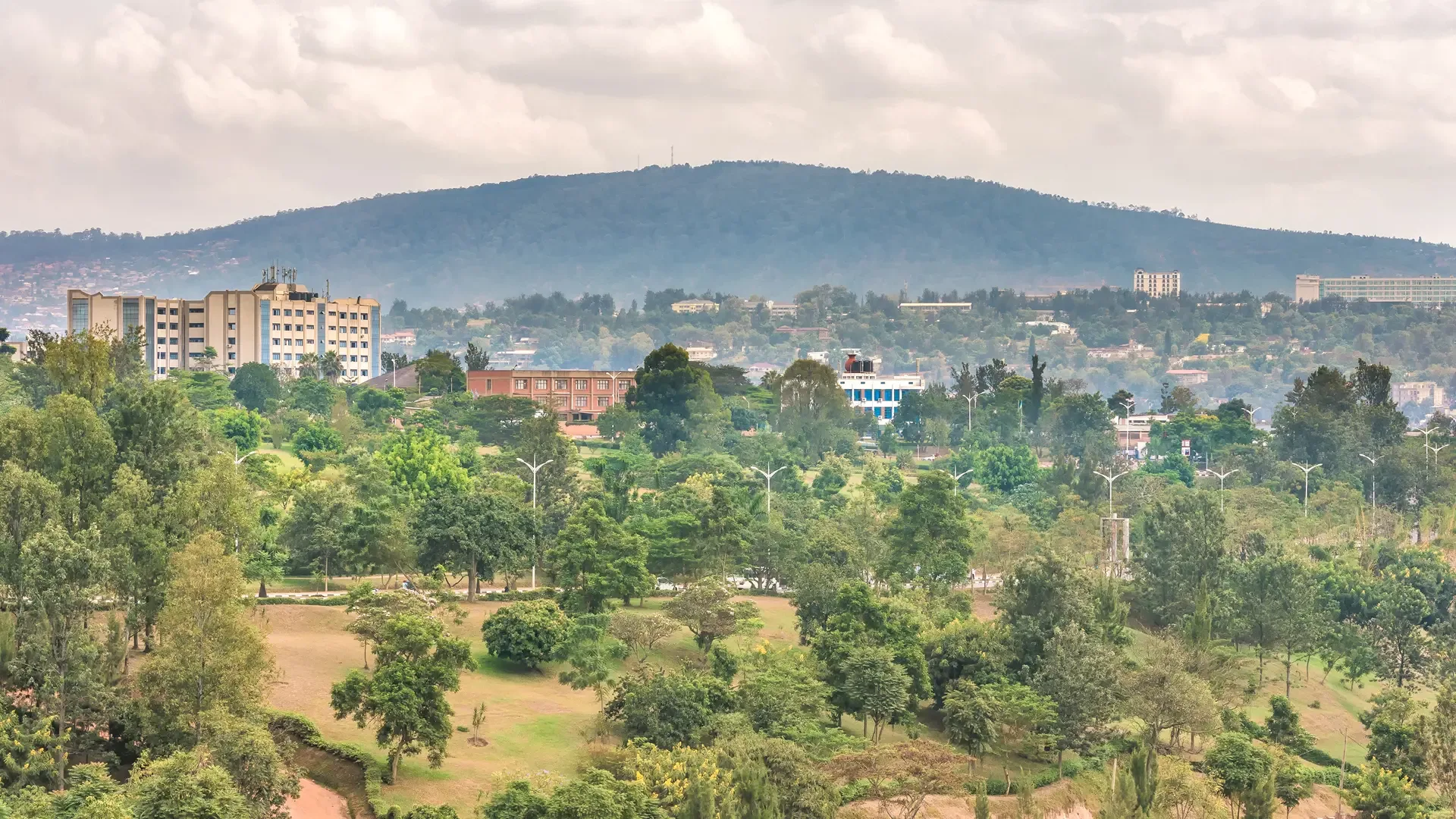 Green hills and city rooftops spread across Kigali, Rwanda.