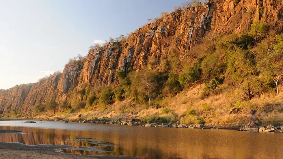 Evening light on the cliffs above the river in Limpopo National Park, Mozambique.