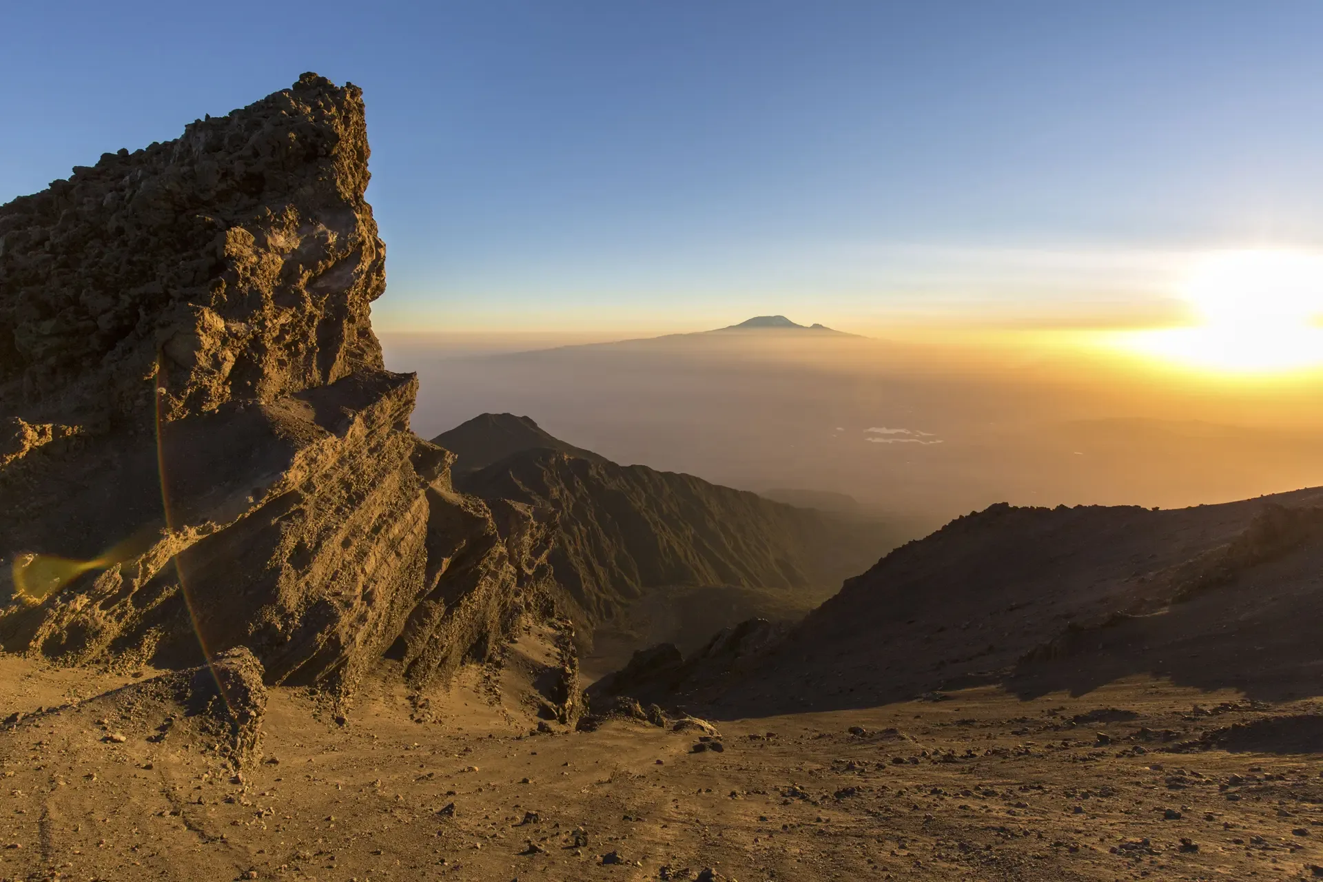 Sunrise over the plains from a rocky viewpoint in Meru National Park, Kenya.
