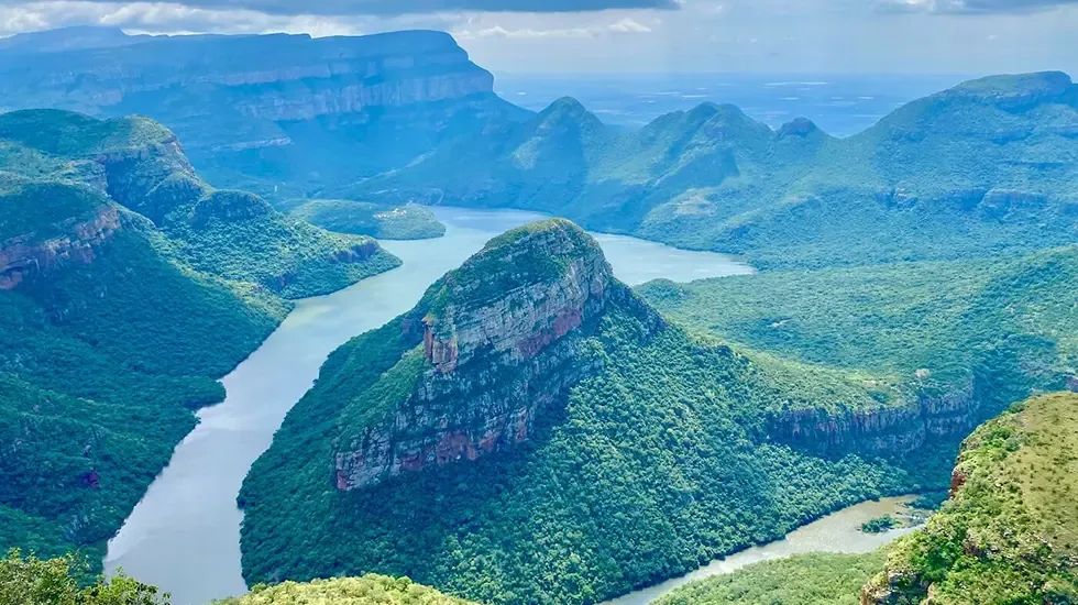 The Blyde River Canyon winds between green peaks along the Panorama Route in South Africa.