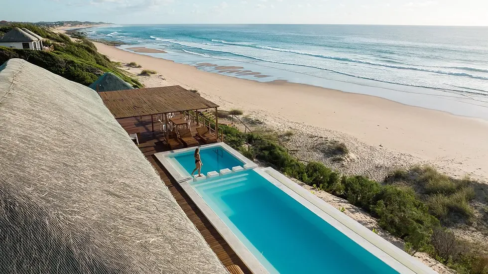 A swim in the pool above the sand at Praia do Tofo, Mozambique.