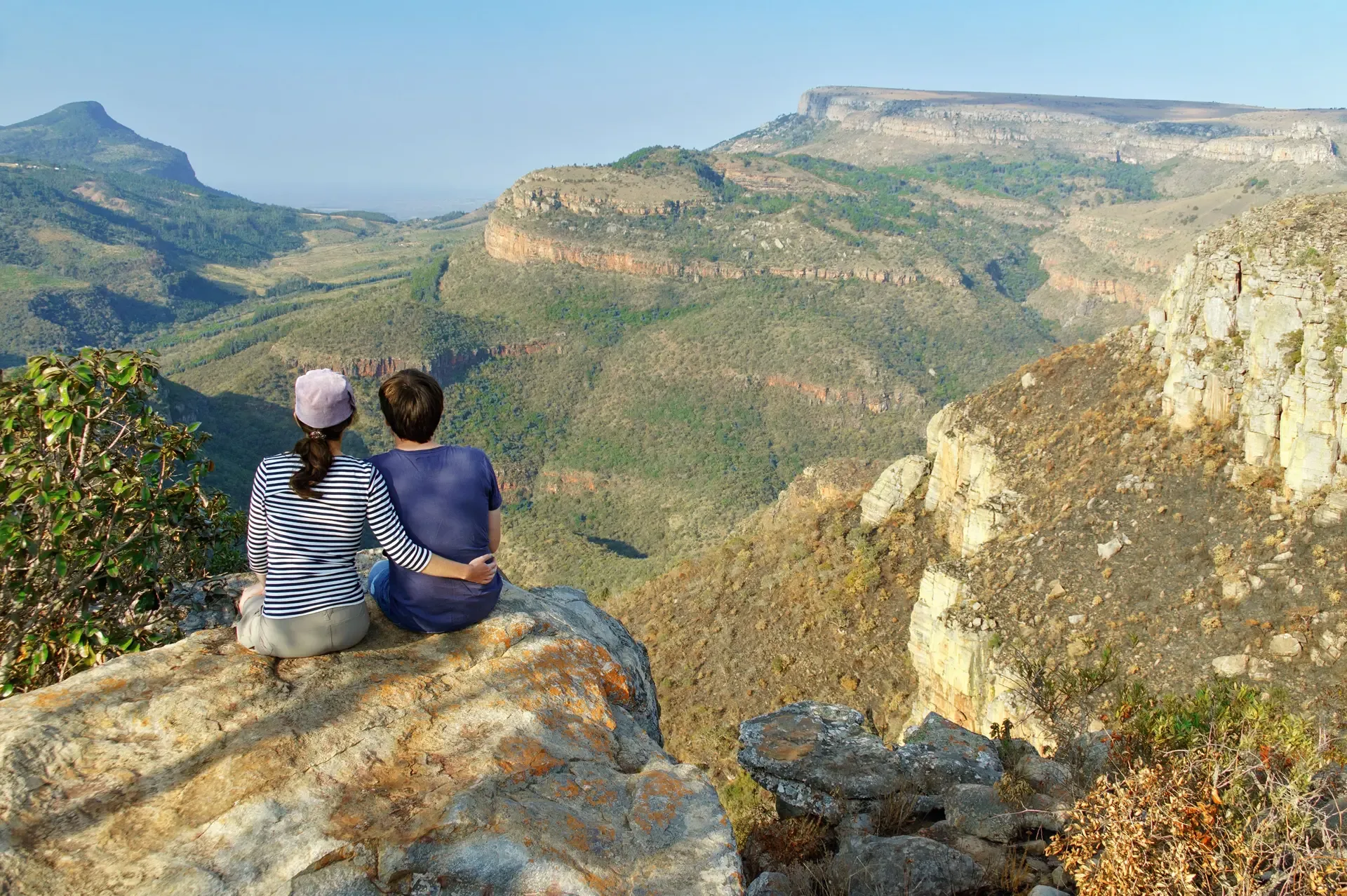Taking in the view over the South African landscape from a rocky ledge.