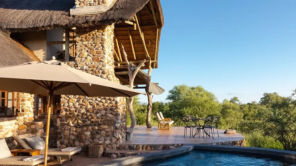 Morning light on the pool deck at a safari lodge in Timbavati, South Africa.