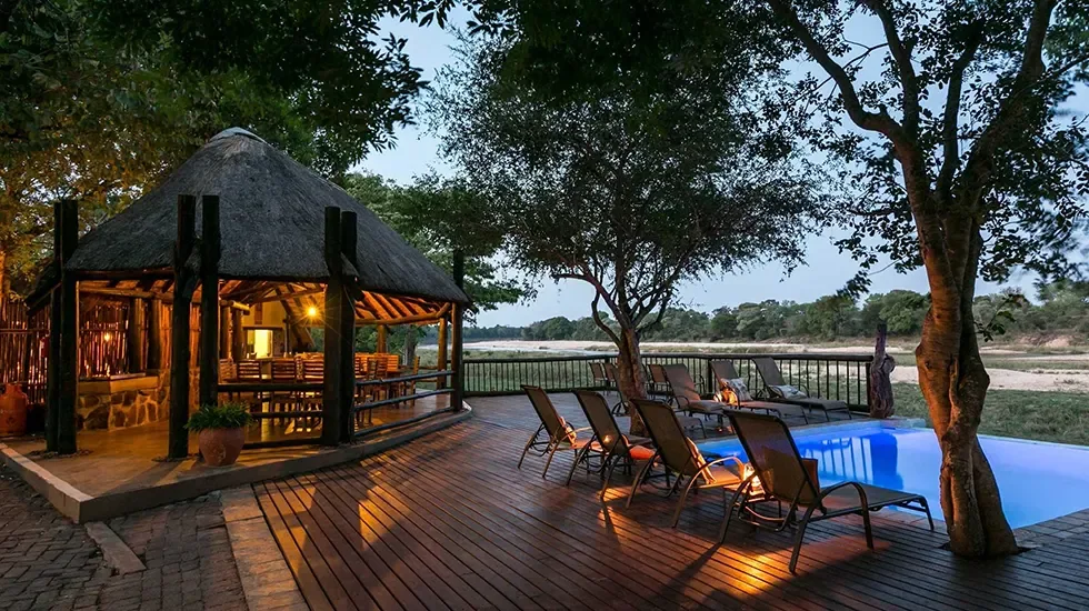 Evening light on the deck and pool at Umkumbe Safari Lodge, South Africa.