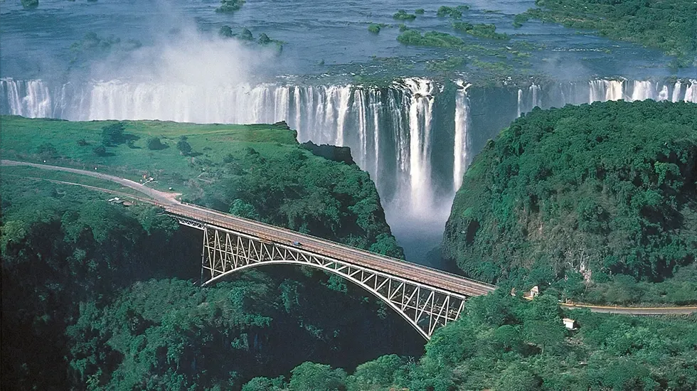 Victoria Falls in full flow, seen with the bridge spanning the gorge below.