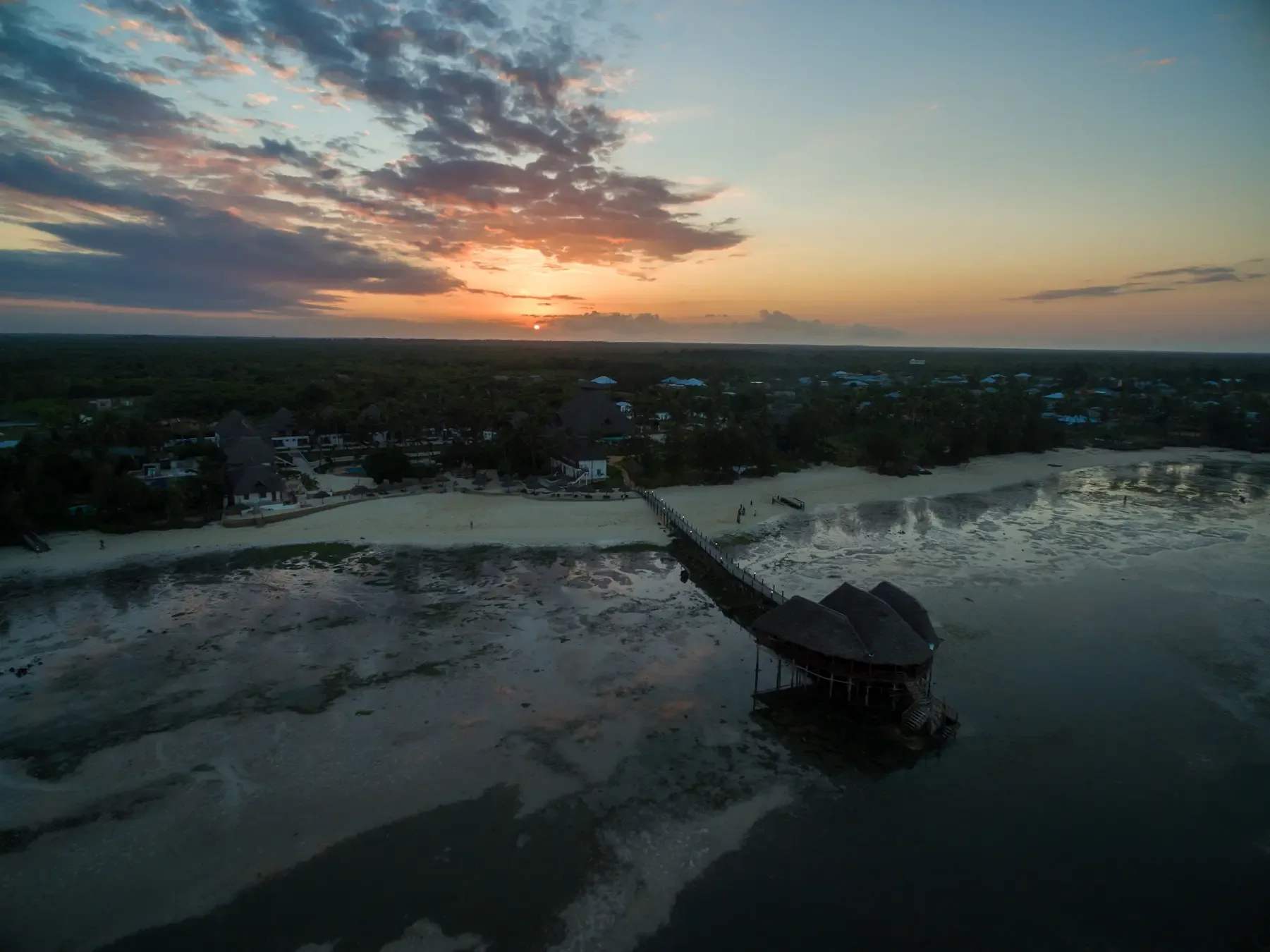 Aerial shot pier beach by ocean captured sunset Zanzibar Africa