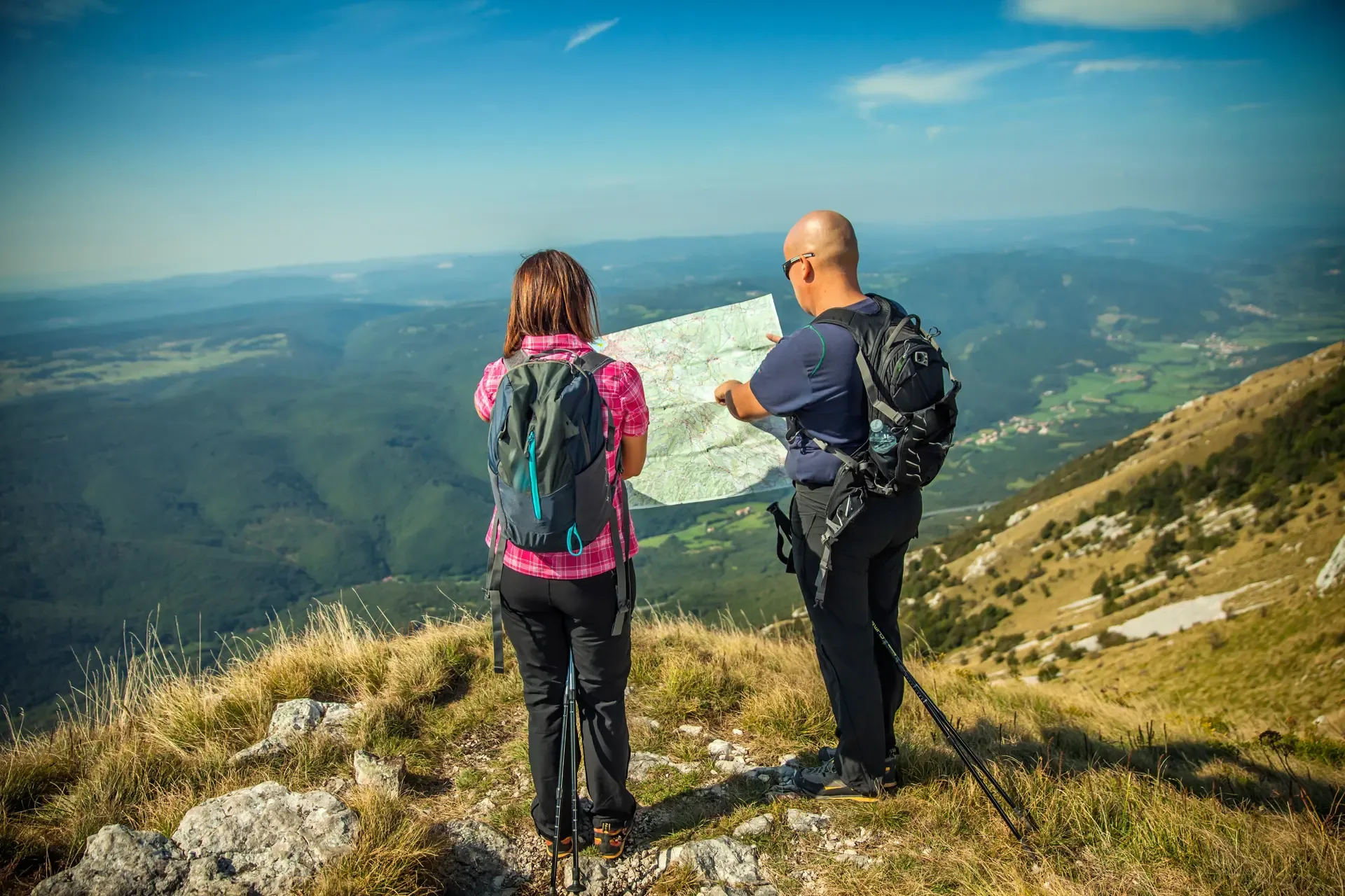 Couple looking map nanos plateau slovenia overlooking vipava valley