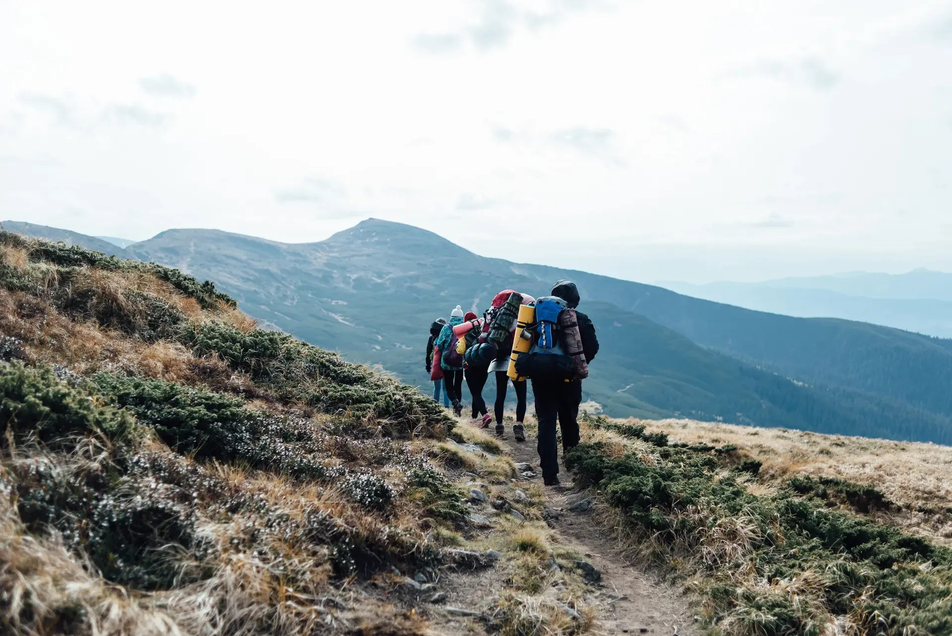Climbers trekking a high mountain ridge in Tanzania.
