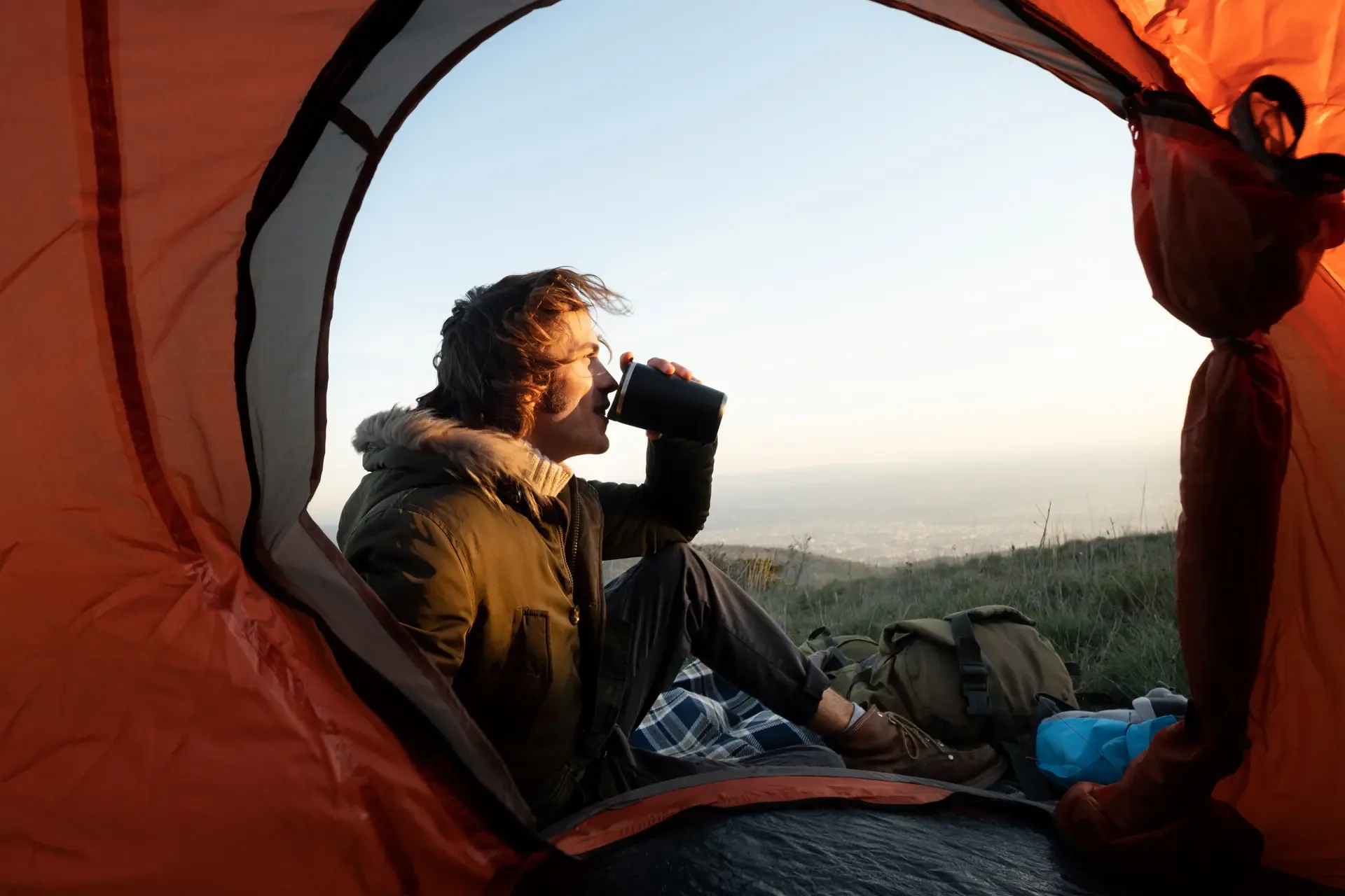 A quiet drink at camp on Mount Kilimanjaro before the day's climb begins.