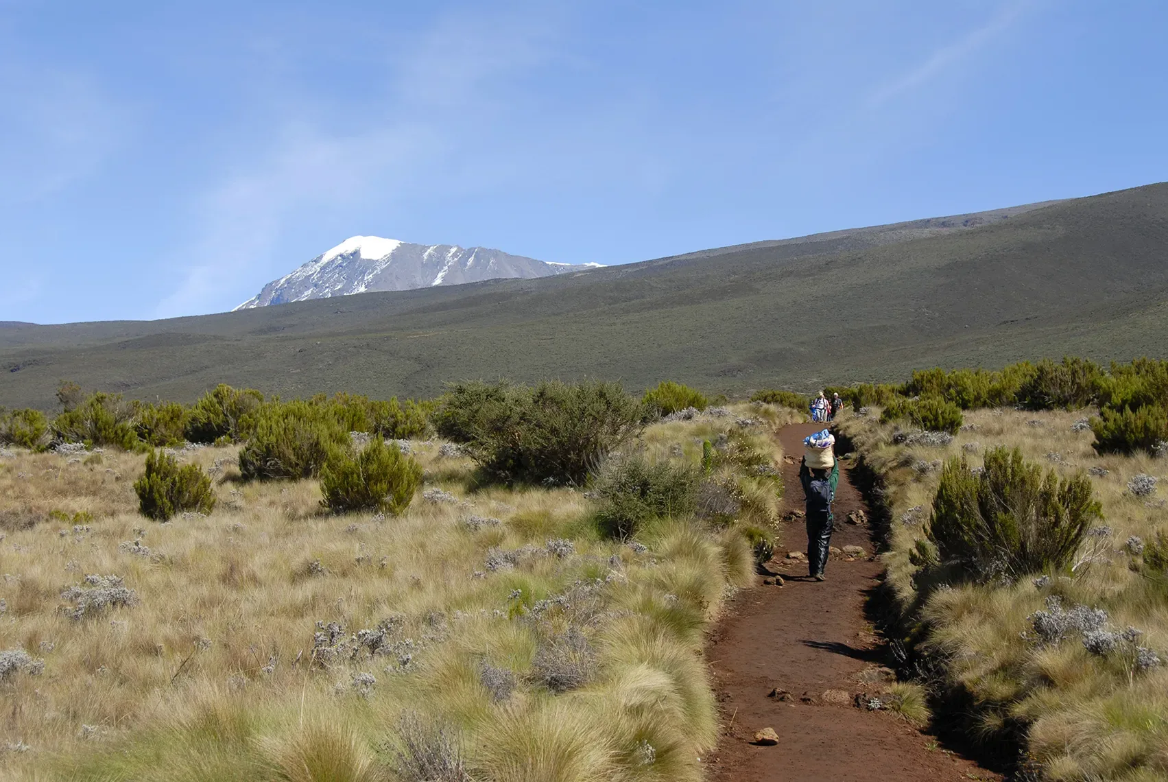 A porter carrying a load on the Marangu route up Kilimanjaro
