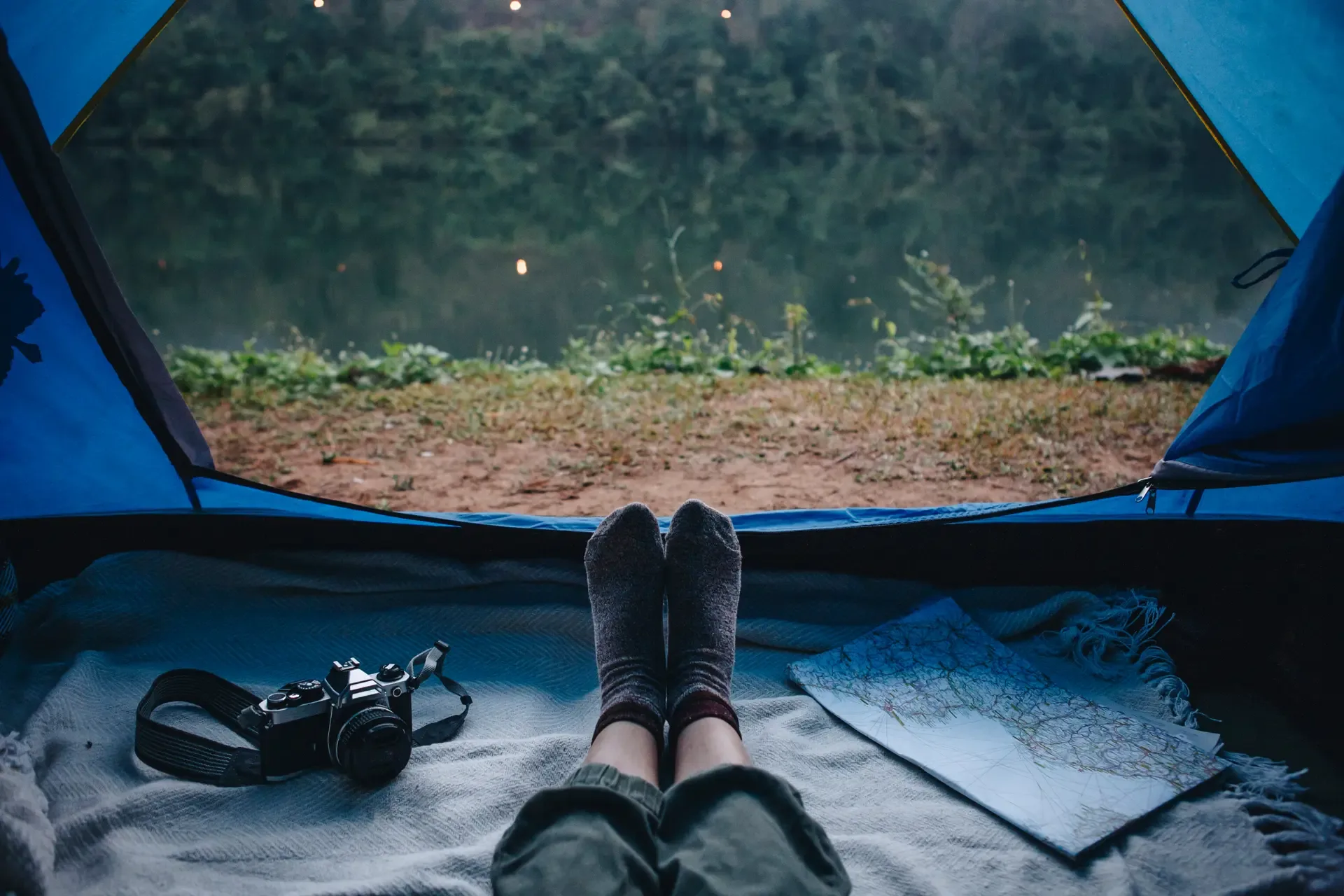 Resting in a tent beside the river before the climb begins.