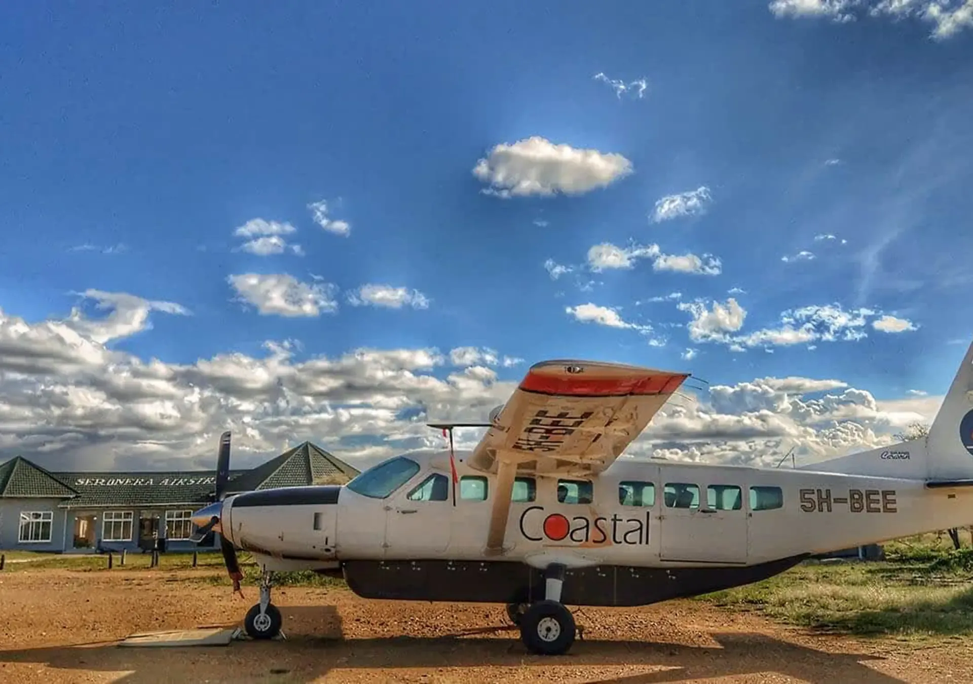 A Coastal plane waiting on the apron at Serengeti Kilimanjaro airport in Tanzania.