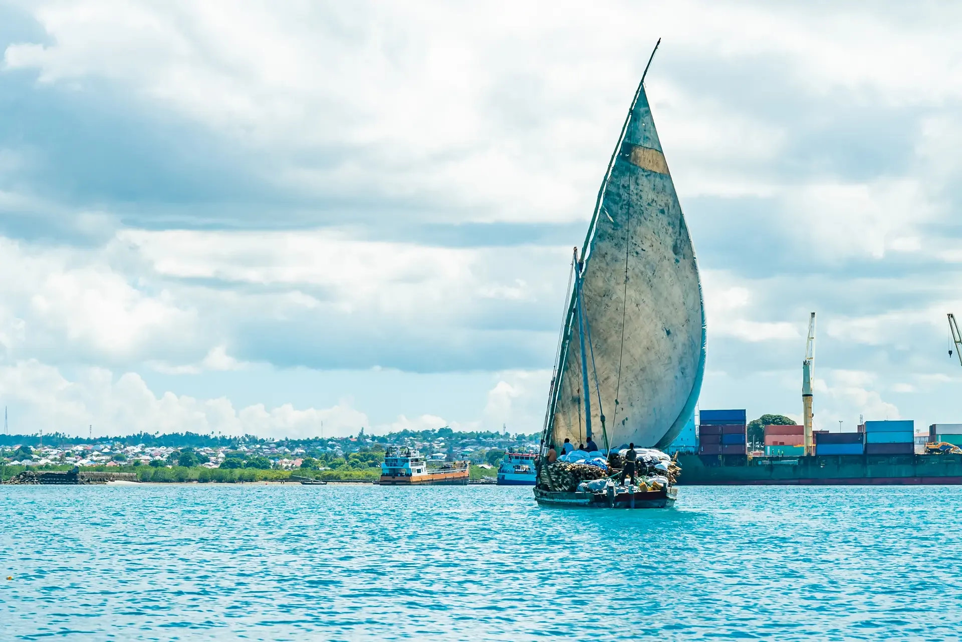 Wooden ship with timber water indian ocean heading port stone town Zanzibar Tanzania